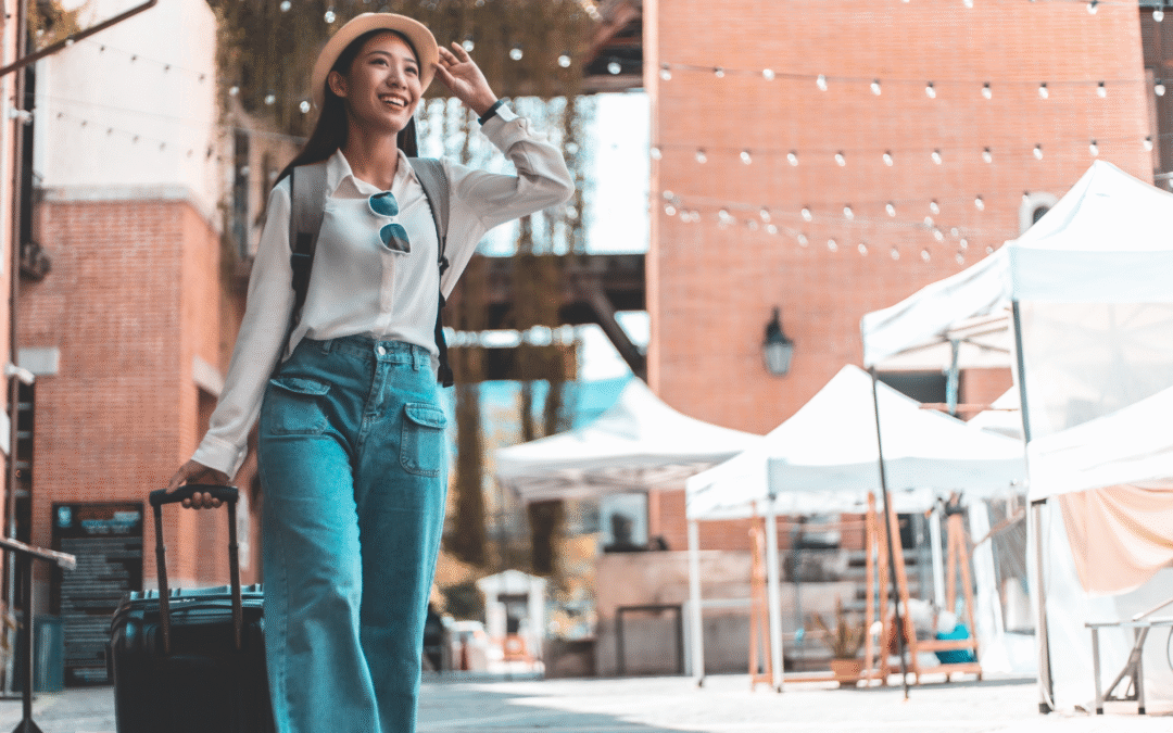 Tourist with suitcase at local market